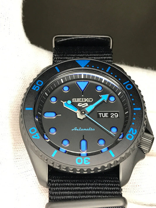 Seiko 5 Sports SRPD81K1 Automatic 100m Water Resistant Black Dial Black Case Blue Markers Black Nato Strap Gents