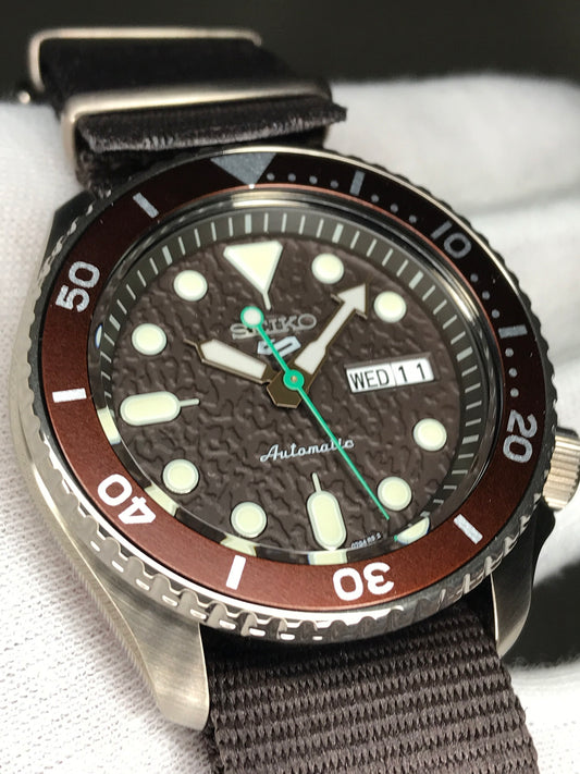 Seiko 5 Sports SRPD85K1 Automatic 100m Water Resistant Brown Dial Hard Coated Case Brown Nato Strap SRPD85  srpd85